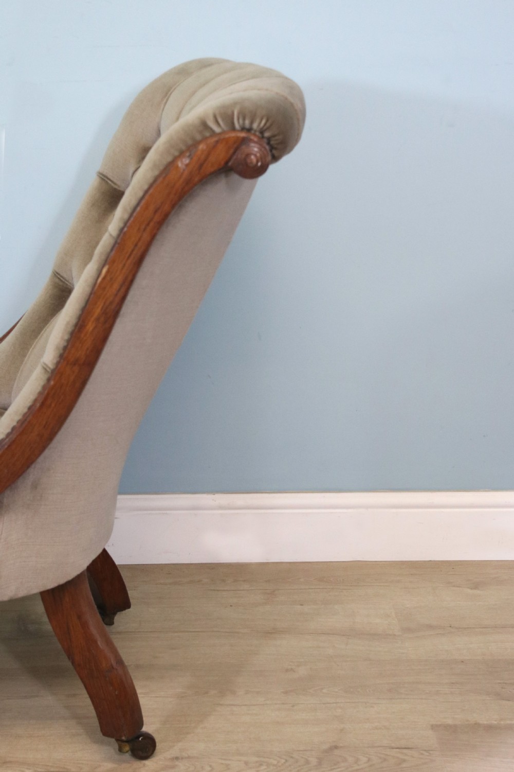 A six-piece late 19th-century chair suite featuring two button-back upholstered armchairs and four matching side chairs upholstered in taupe velvet with turned wooden front legs on castors. View XXVIII