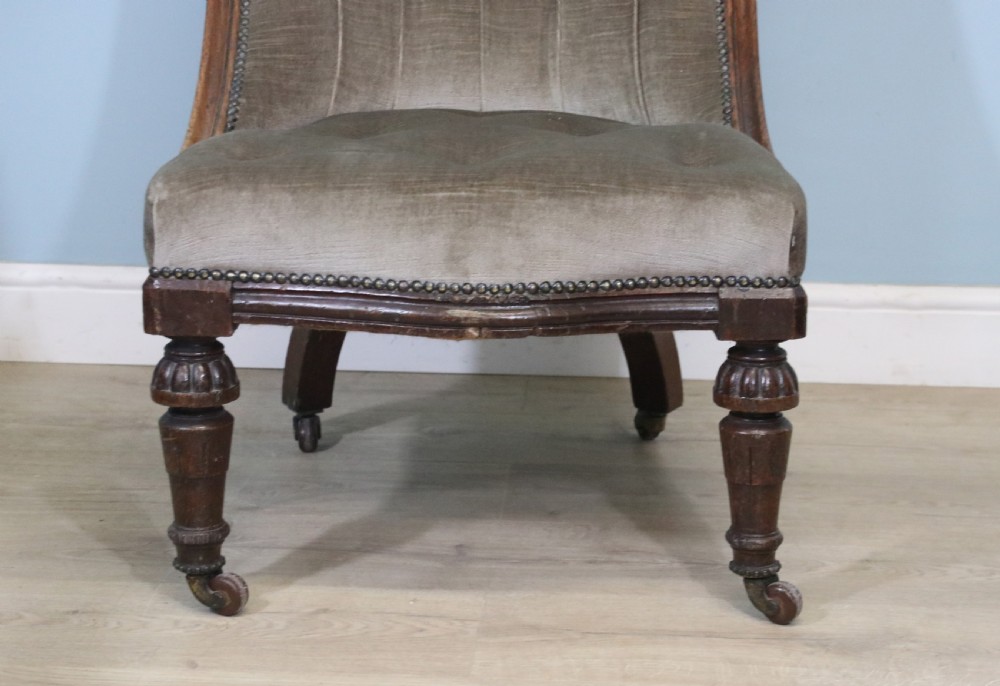 A six-piece late 19th-century chair suite featuring two button-back upholstered armchairs and four matching side chairs upholstered in taupe velvet with turned wooden front legs on castors. View XXIX