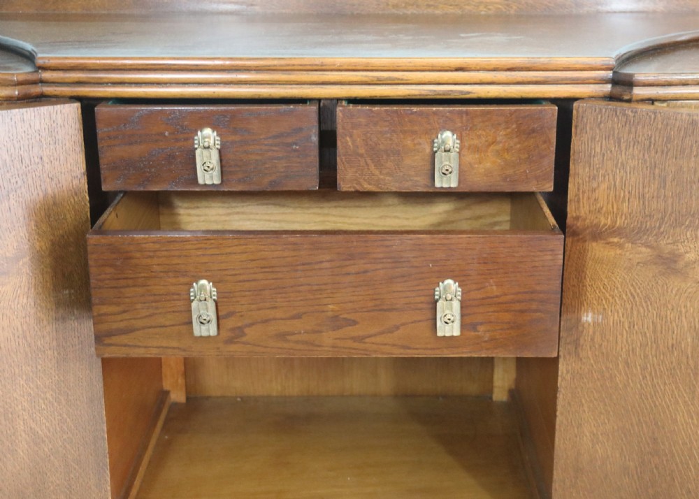 An imposing oak combination drinks cabinet and sideboard View XX