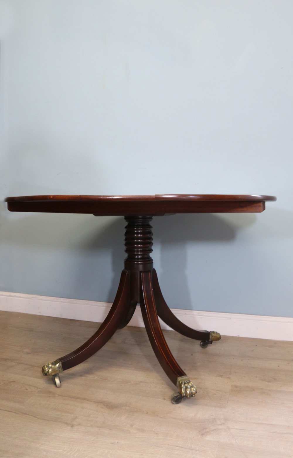 A fine English Antique! A lovely 19th century mahogany oval dining table.  View III