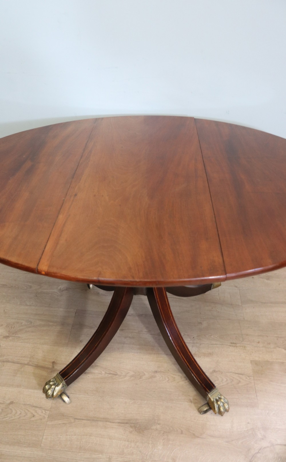 A fine English Antique! A lovely 19th century mahogany oval dining table.  View VI