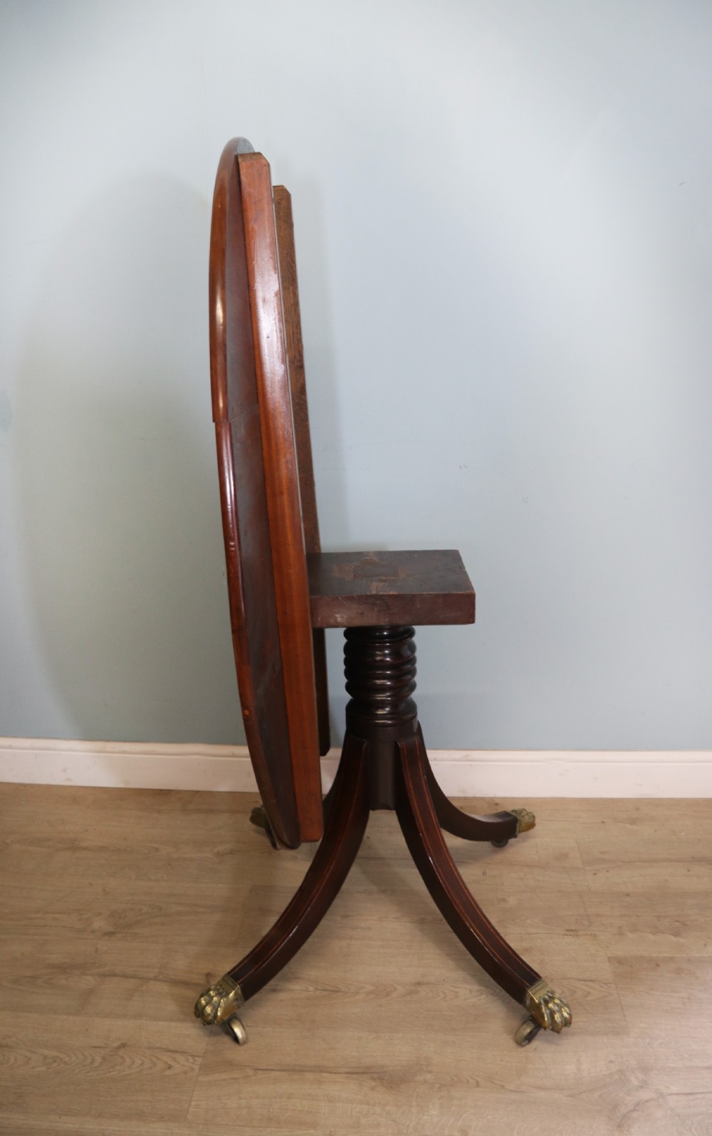 A fine English Antique! A lovely 19th century mahogany oval dining table.  View XIII