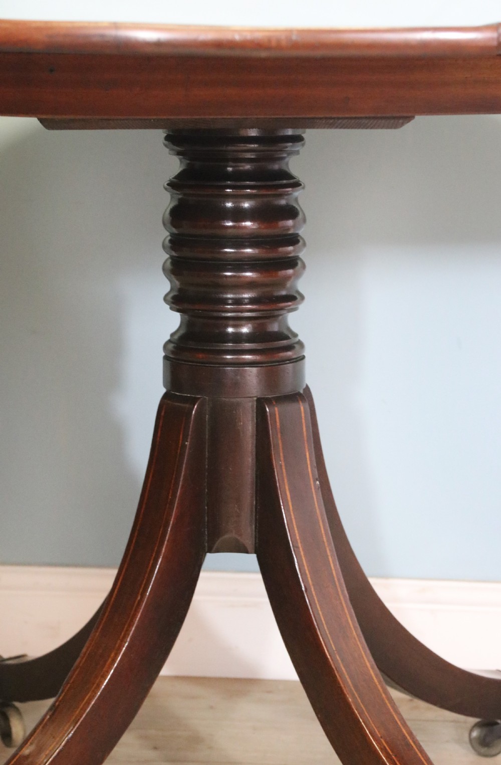 A fine English Antique! A lovely 19th century mahogany oval dining table.  View XVI