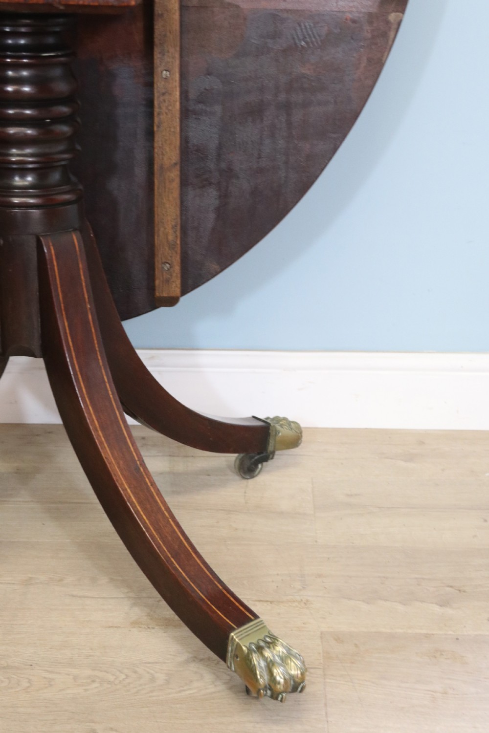 A fine English Antique! A lovely 19th century mahogany oval dining table.  View XVII