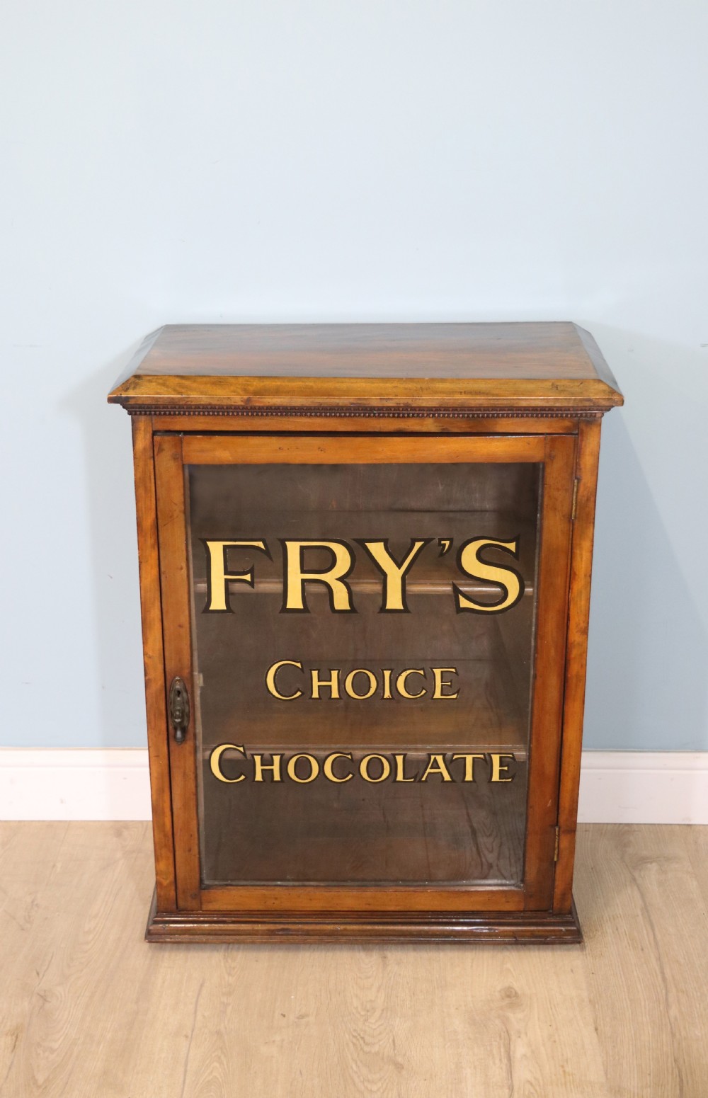 Edwardian hardwood single door display cabinet with 24ct Gold Leaf for Fry’s Choice Chocolate. View II