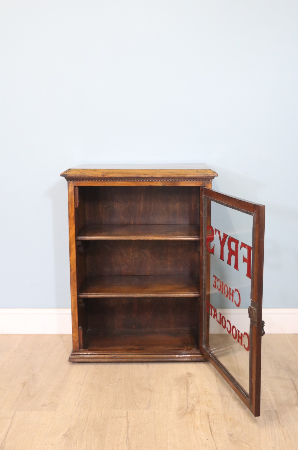 Edwardian hardwood single door display cabinet with 24ct Gold Leaf for Fry’s Choice Chocolate. View VI