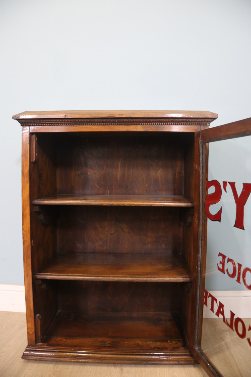 Edwardian hardwood single door display cabinet with 24ct Gold Leaf for Fry’s Choice Chocolate. View VII