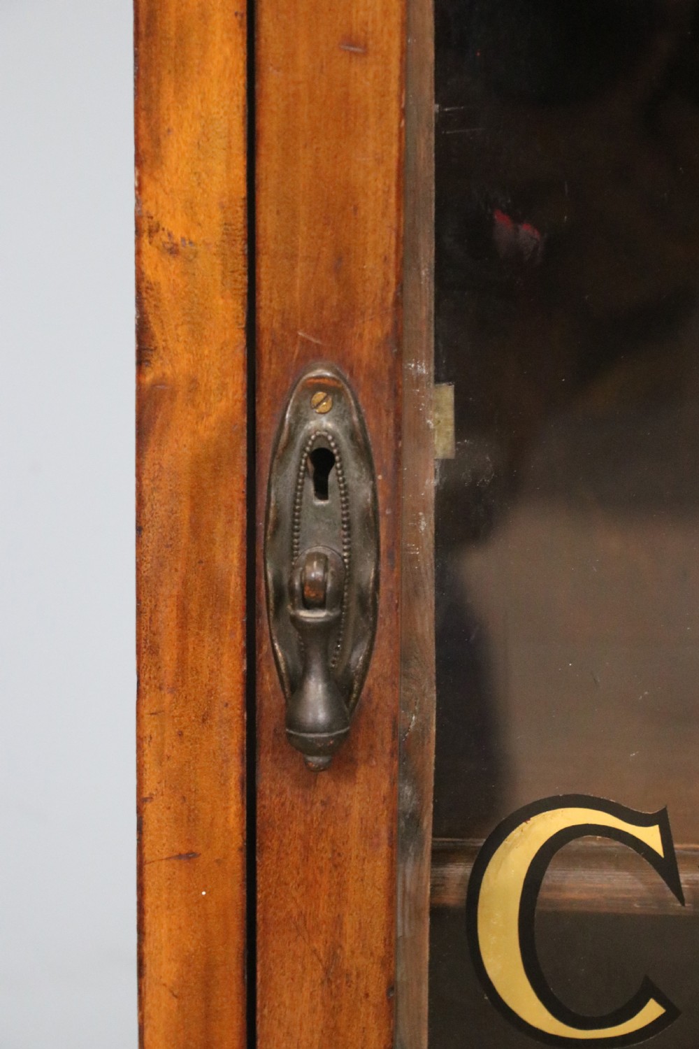 Edwardian hardwood single door display cabinet with 24ct Gold Leaf for Fry’s Choice Chocolate. View XII