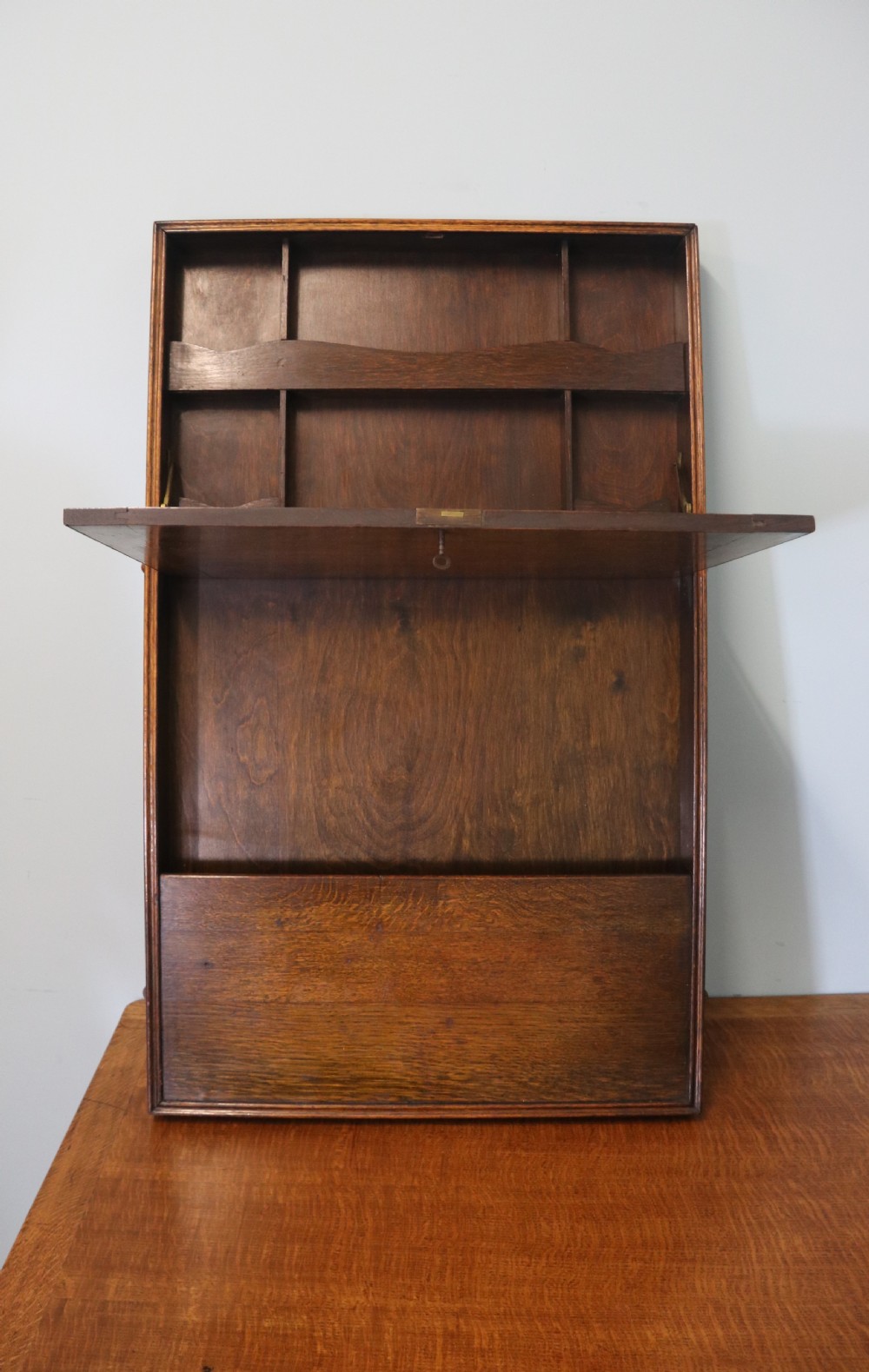 This early 20th century wall mounted oak combination desk and letter rack View II