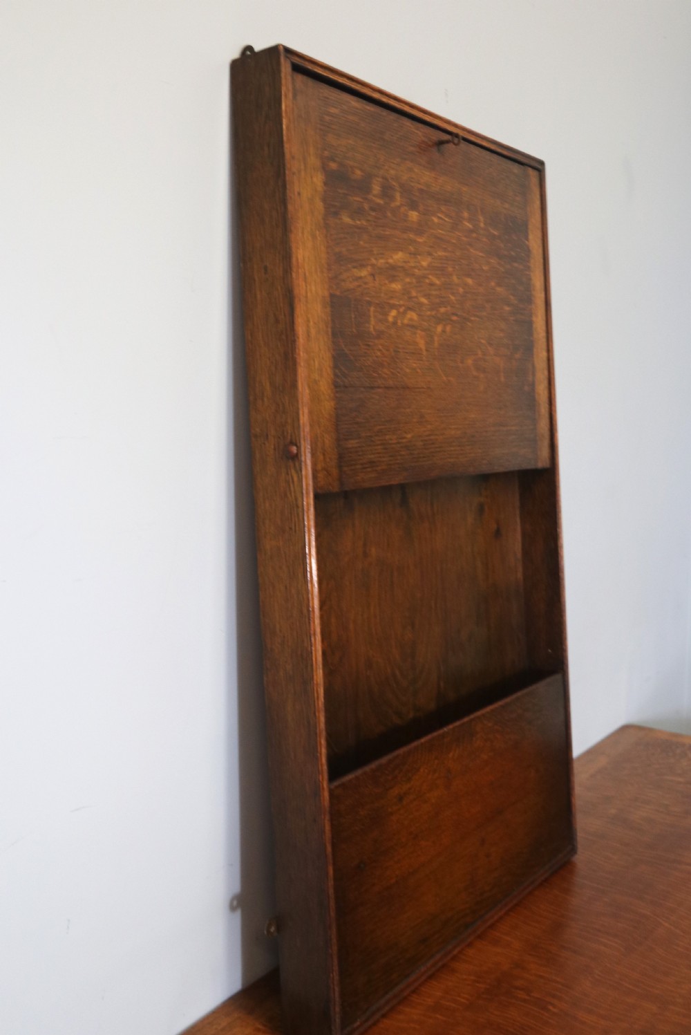 This early 20th century wall mounted oak combination desk and letter rack View III