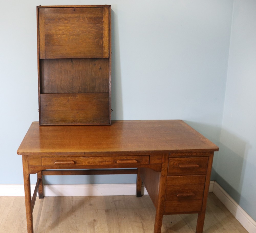This early 20th century wall mounted oak combination desk and letter rack View IV