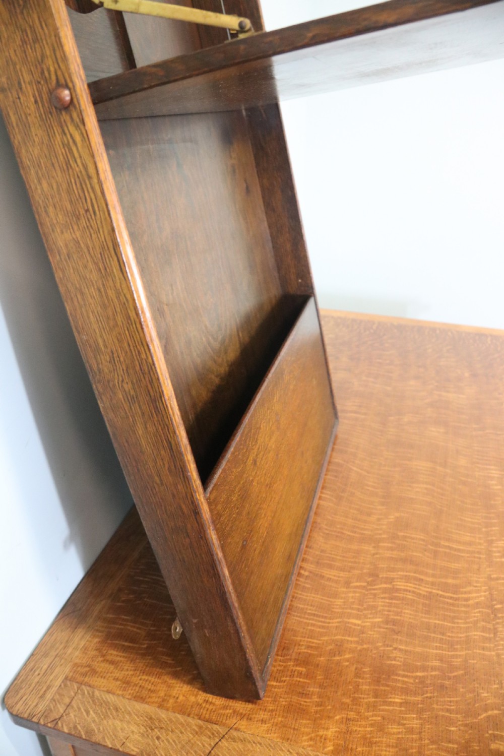 This early 20th century wall mounted oak combination desk and letter rack View IX