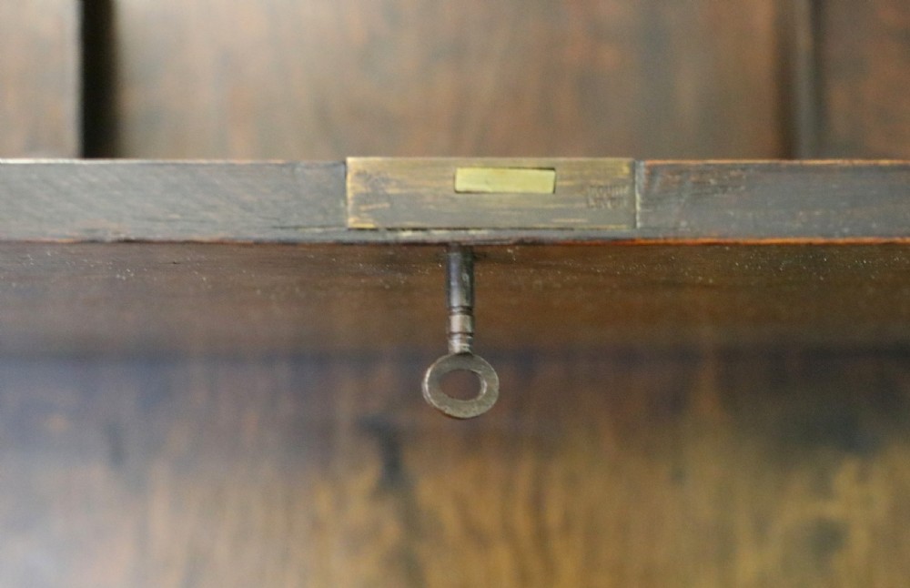 This early 20th century wall mounted oak combination desk and letter rack View XII