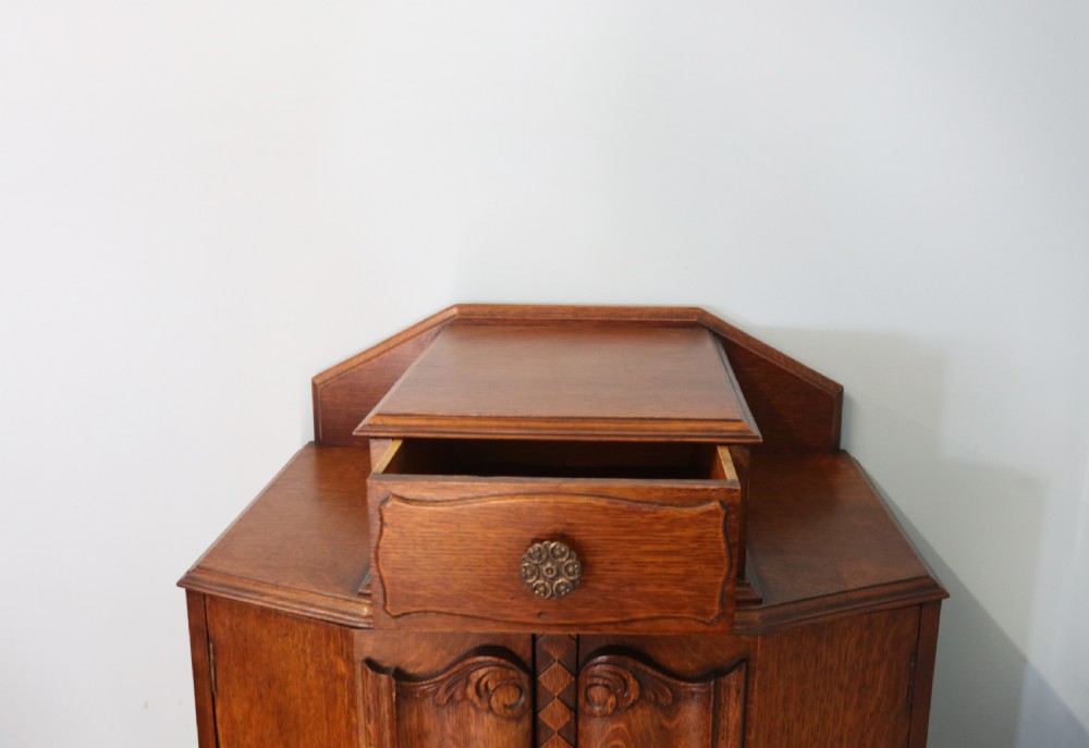 Oak side cabinet dates from the 1930s View VII