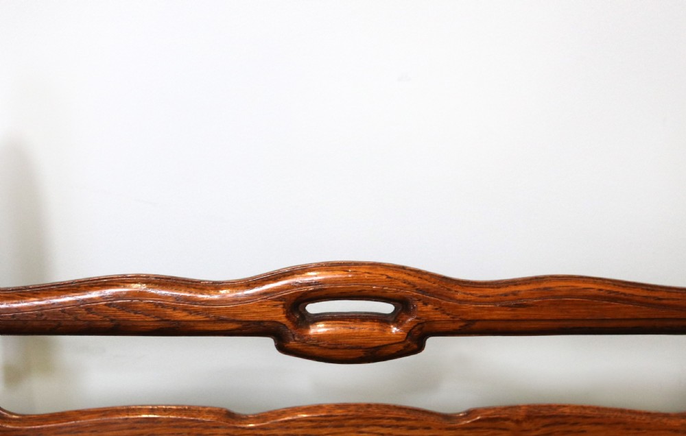 A lovely early 20th century oak magazine rack  View VII