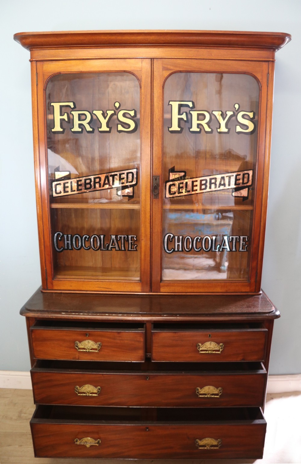 A lovely antique mahogany advertising cabinet.  View II