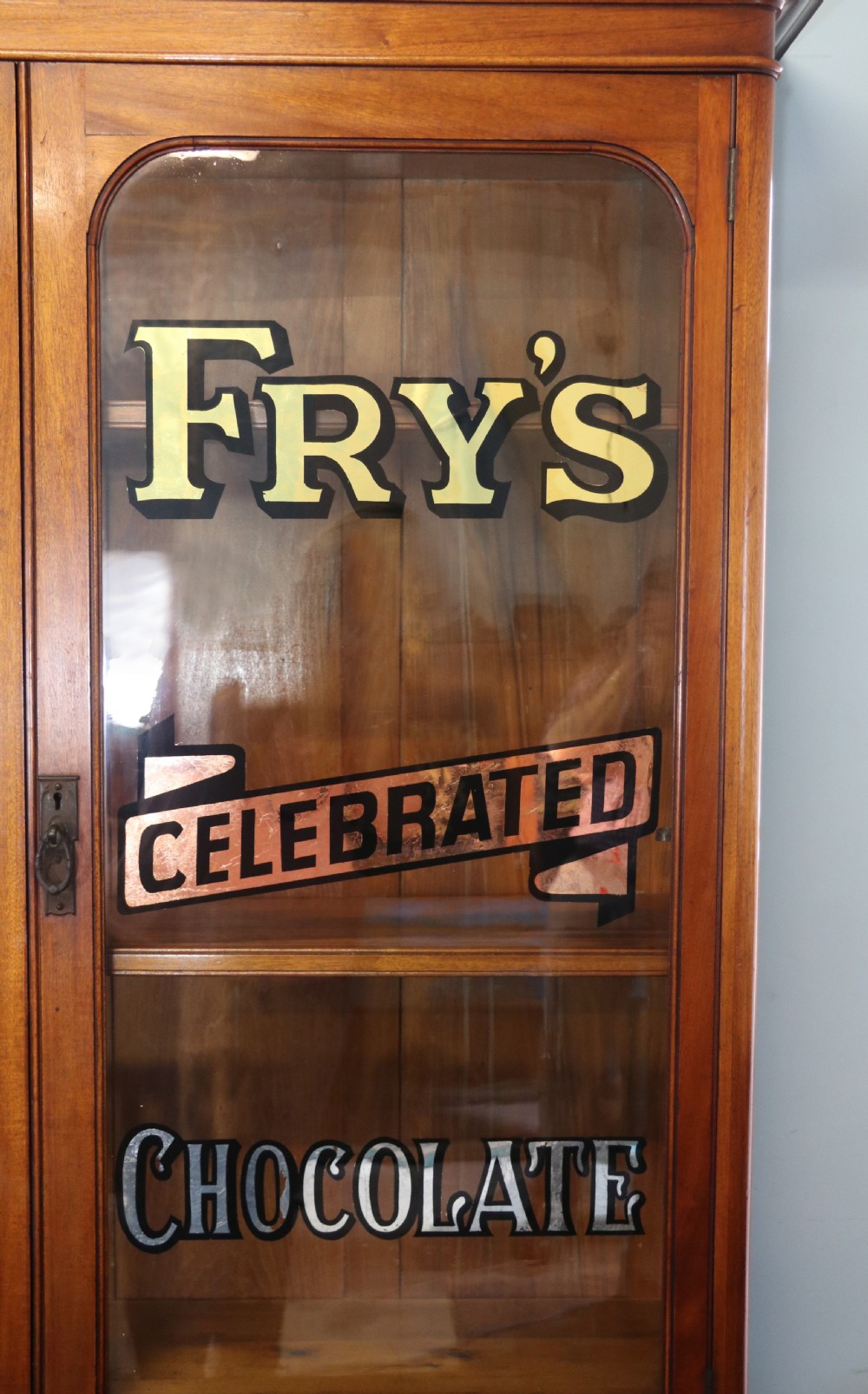 A lovely antique mahogany advertising cabinet.  View VI