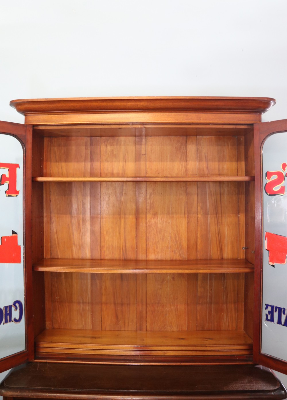 A lovely antique mahogany advertising cabinet.  View VIII
