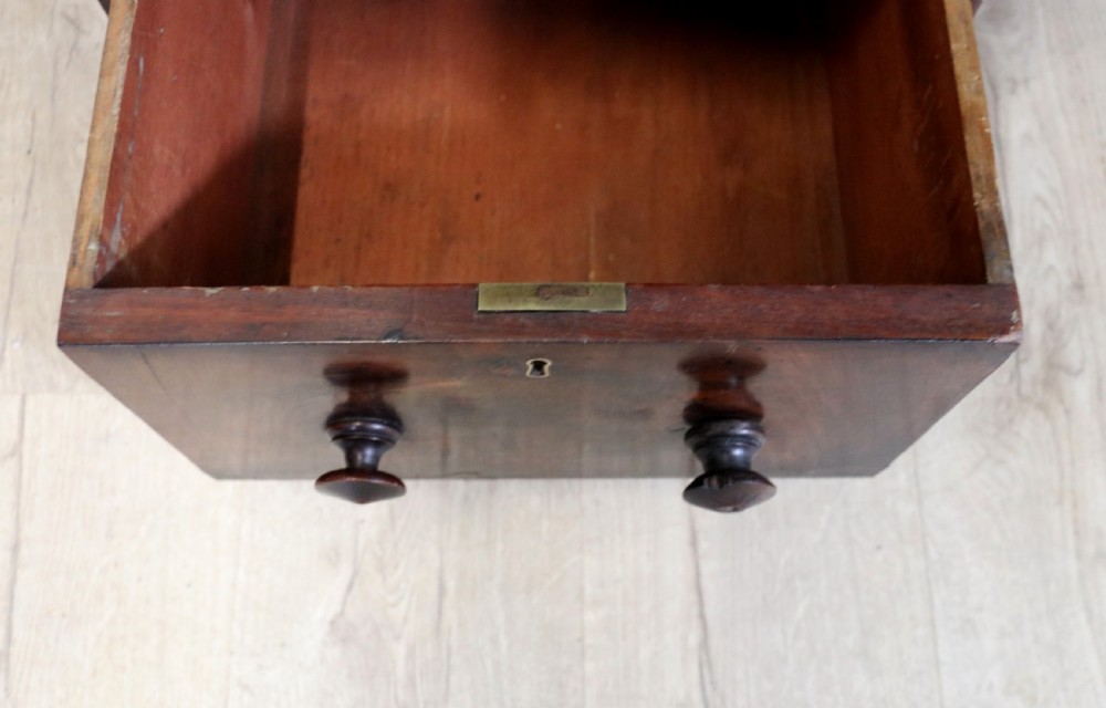 Lovely flame mahogany veneered twin pedestal desk has a tooled leather writing surface  View XI