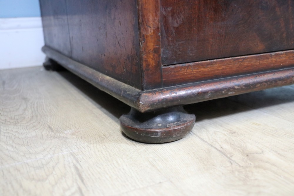 Lovely flame mahogany veneered twin pedestal desk has a tooled leather writing surface  View XIII