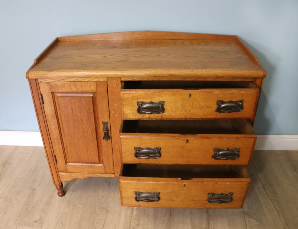 This lovely Arts and Crafts influenced side cabinet View V