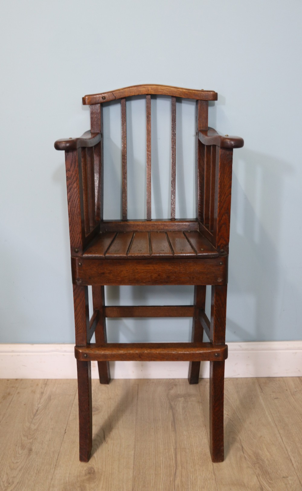 A lovely early 20th century oak highchair. 