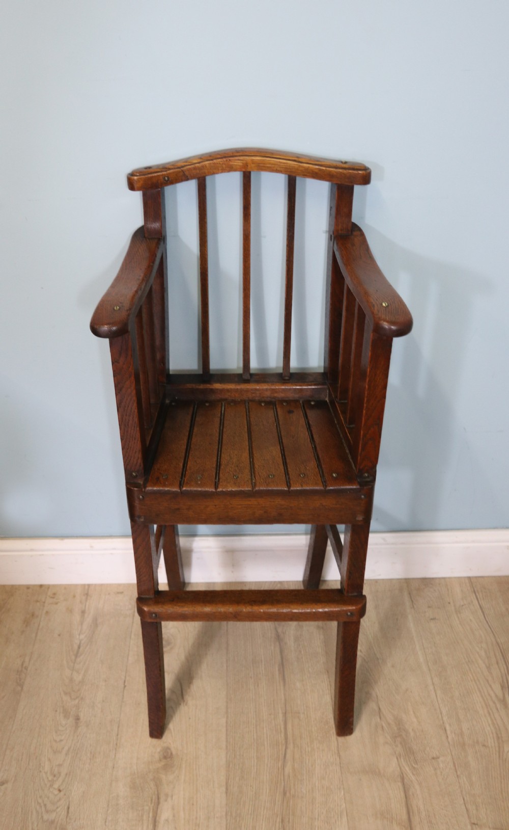 A lovely early 20th century oak highchair.  View II