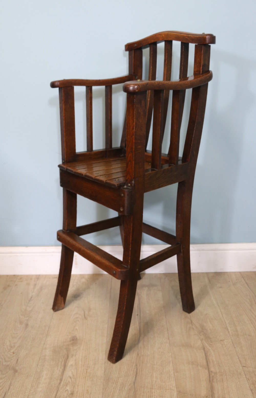 A lovely early 20th century oak highchair.  View III