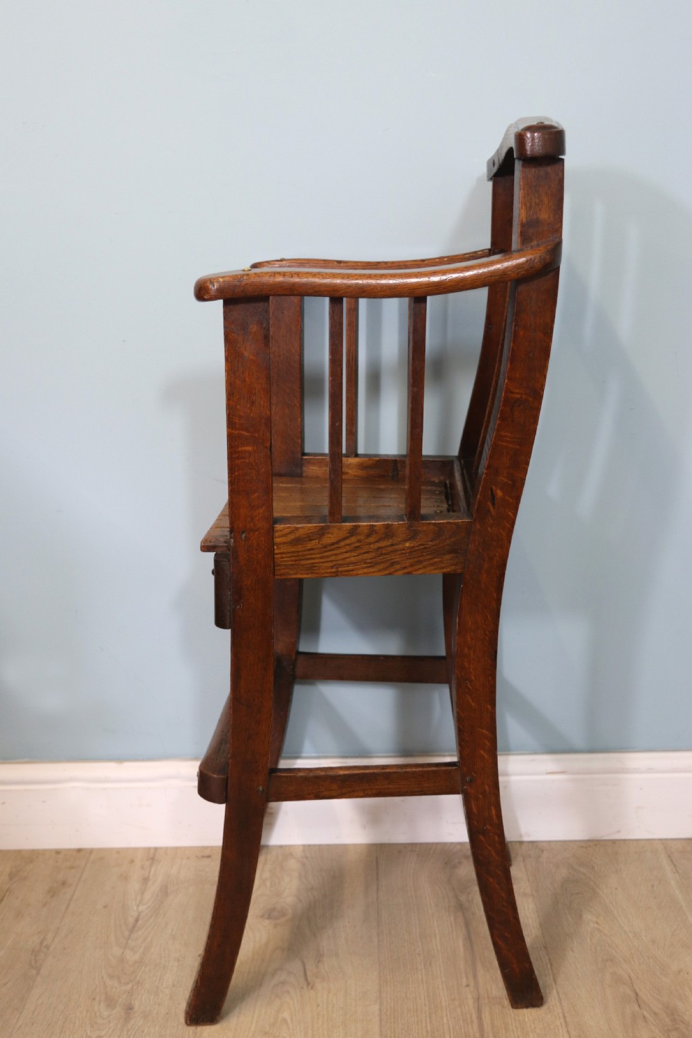 A lovely early 20th century oak highchair.  View IV