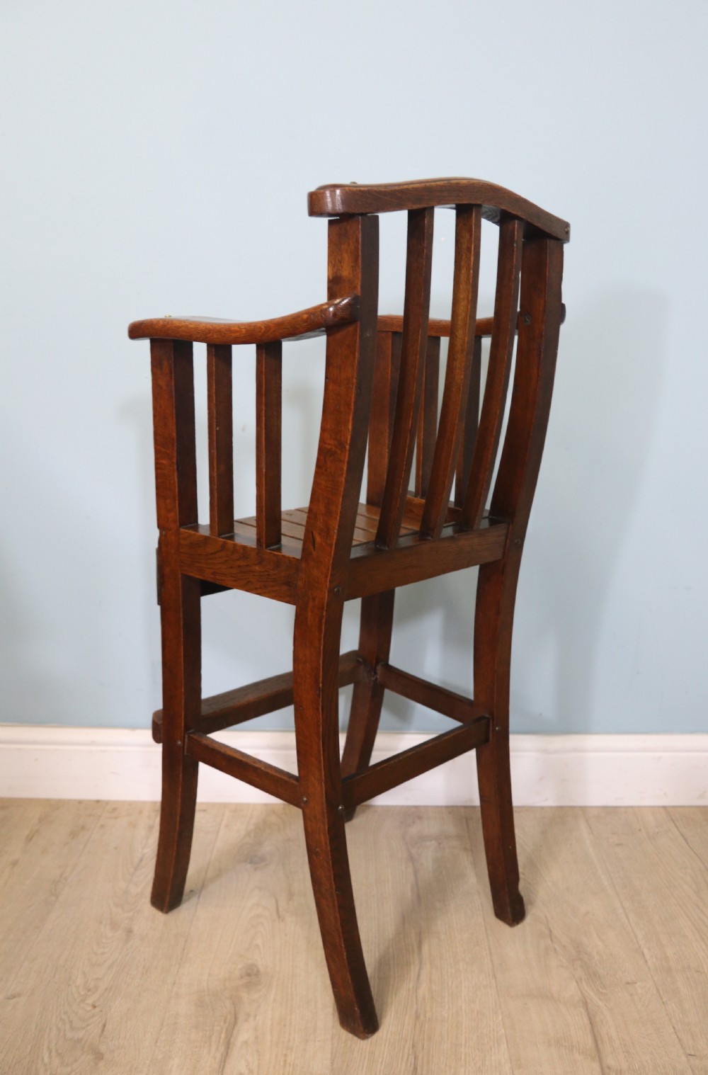 A lovely early 20th century oak highchair.  View VI