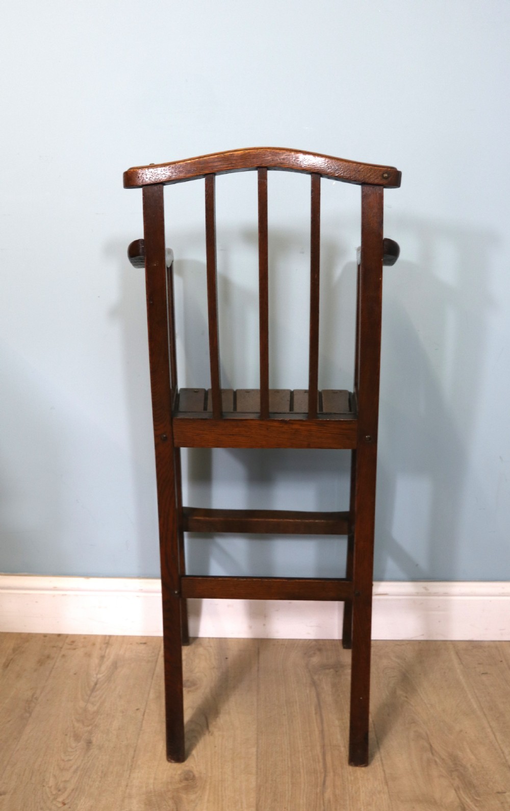 A lovely early 20th century oak highchair.  View VII