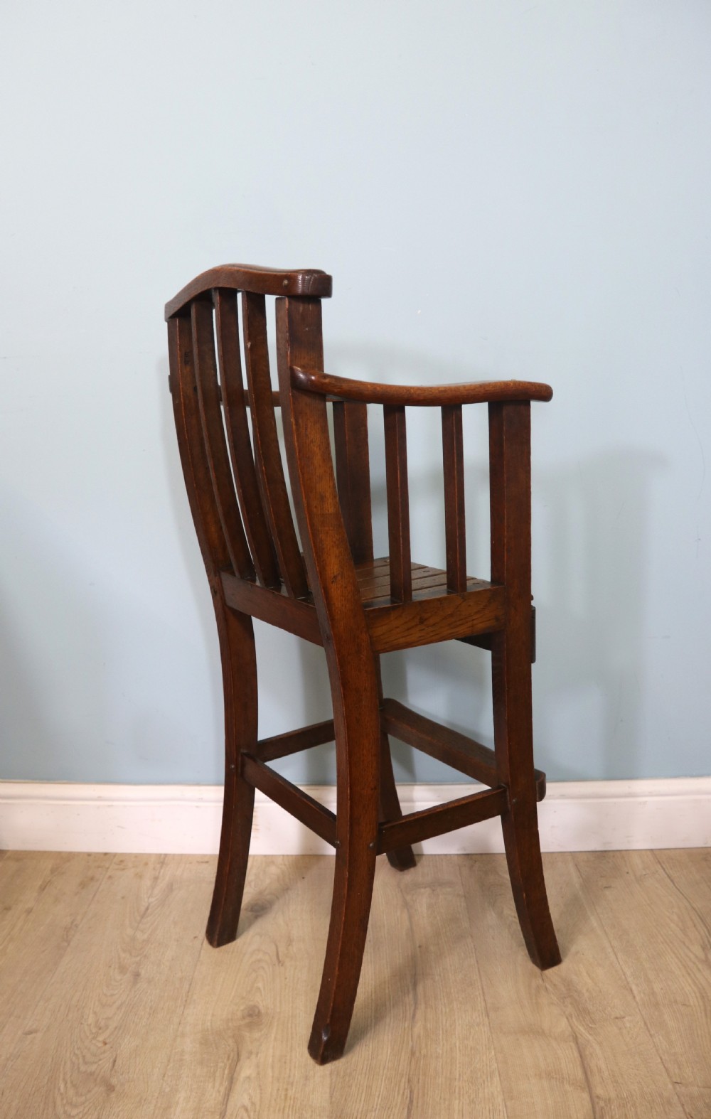 A lovely early 20th century oak highchair.  View VIII