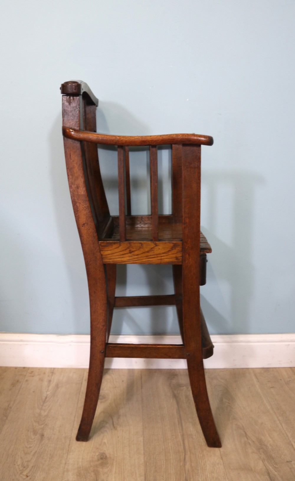 A lovely early 20th century oak highchair.  View IX