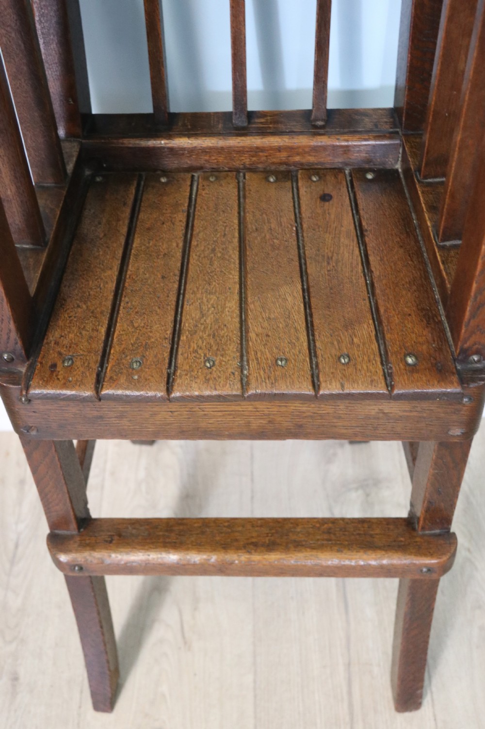 A lovely early 20th century oak highchair.  View XIII