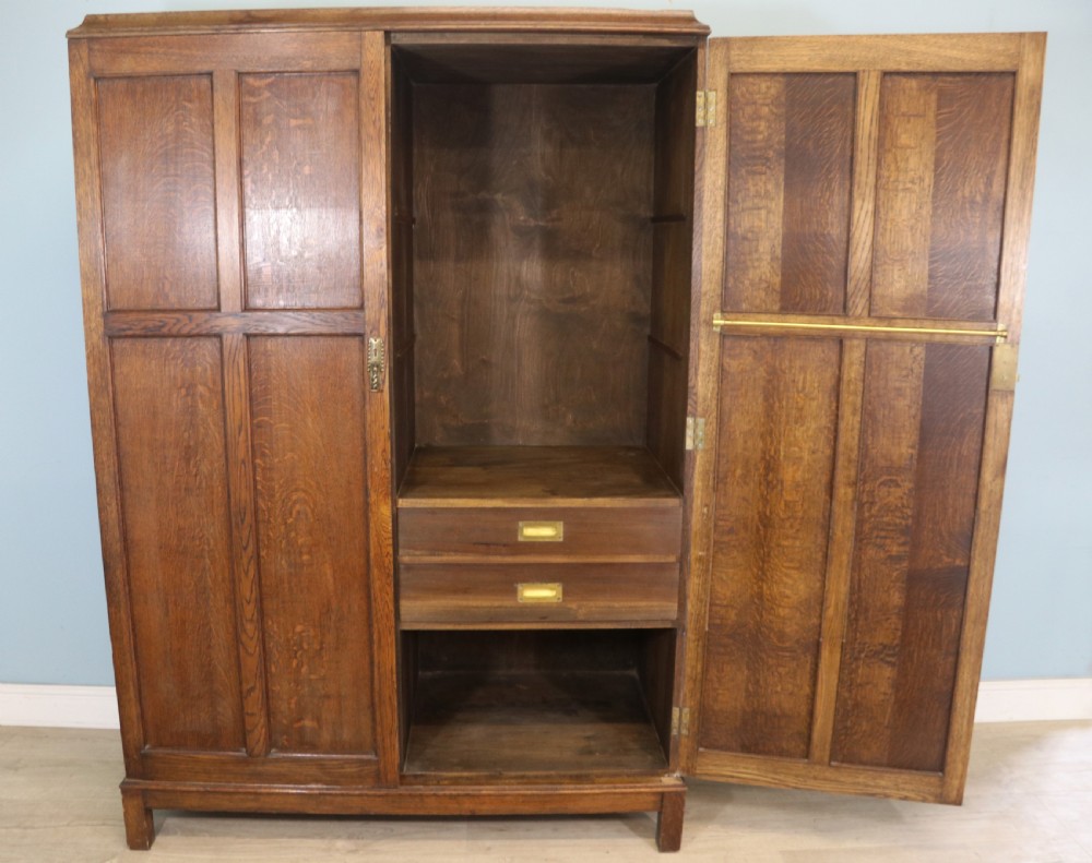 A lovely late 19th or early 20th century oak wardrobe in the ‘campaign’ style. View III