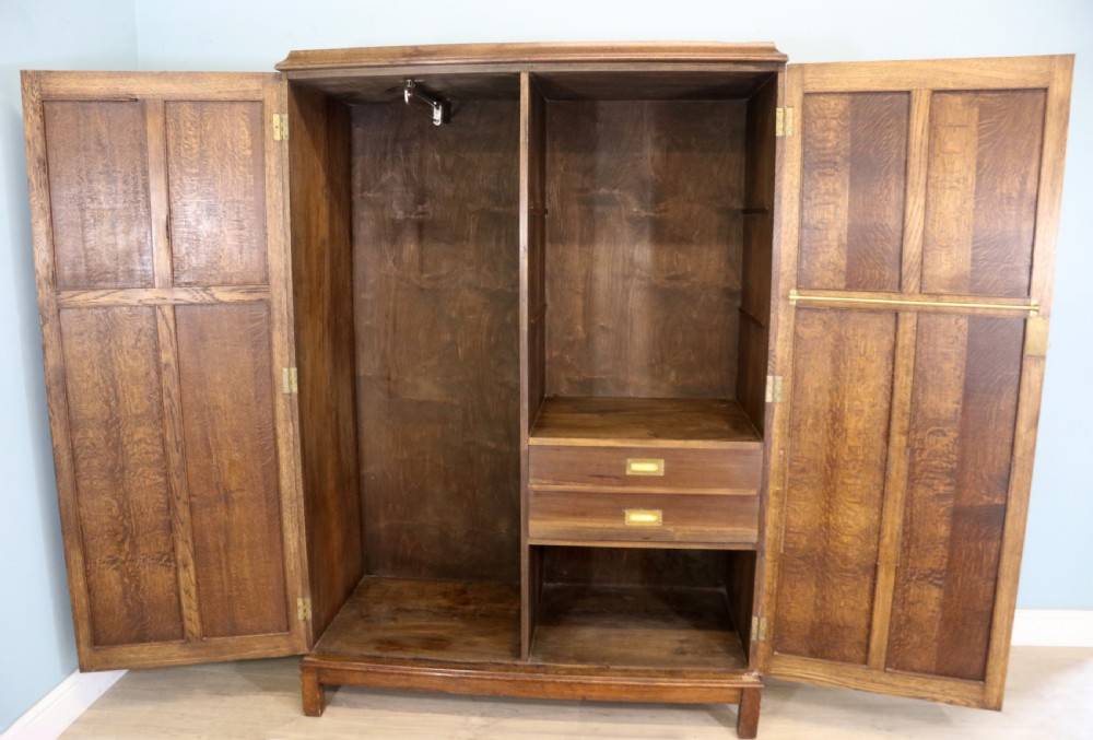 A lovely late 19th or early 20th century oak wardrobe in the ‘campaign’ style. View V
