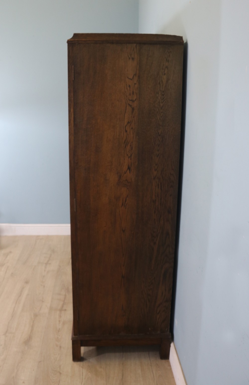 A lovely late 19th or early 20th century oak wardrobe in the ‘campaign’ style. View VI