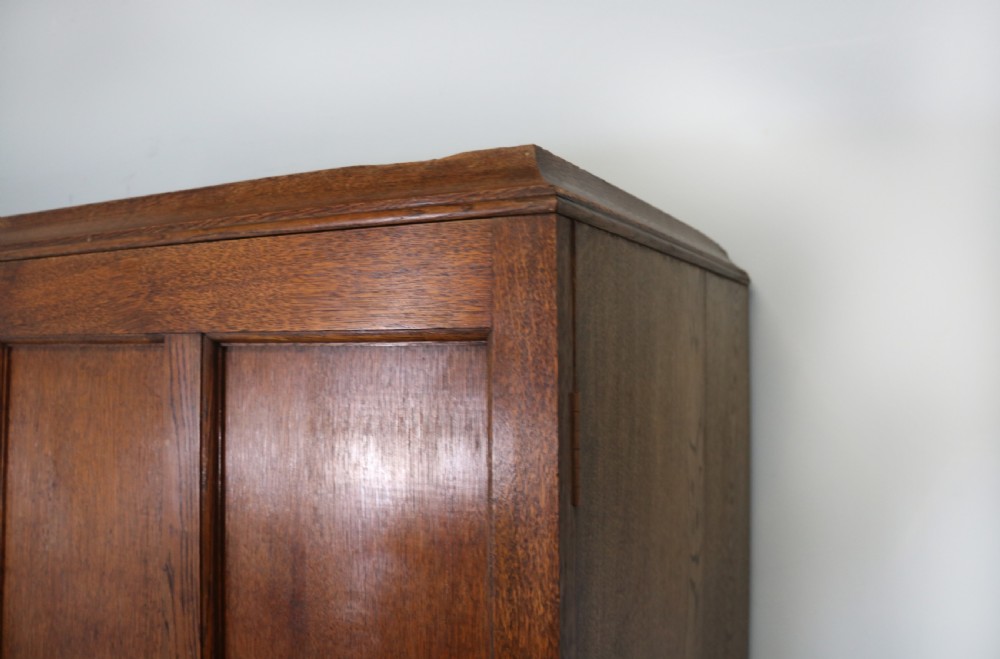 A lovely late 19th or early 20th century oak wardrobe in the ‘campaign’ style. View VII