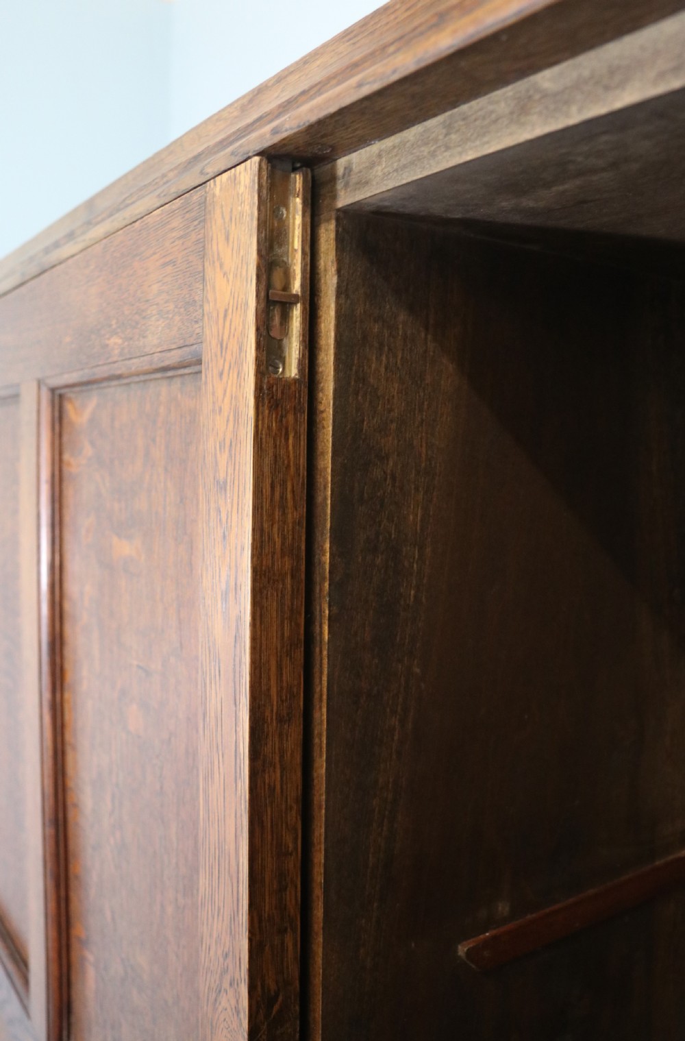 A lovely late 19th or early 20th century oak wardrobe in the ‘campaign’ style. View VIII