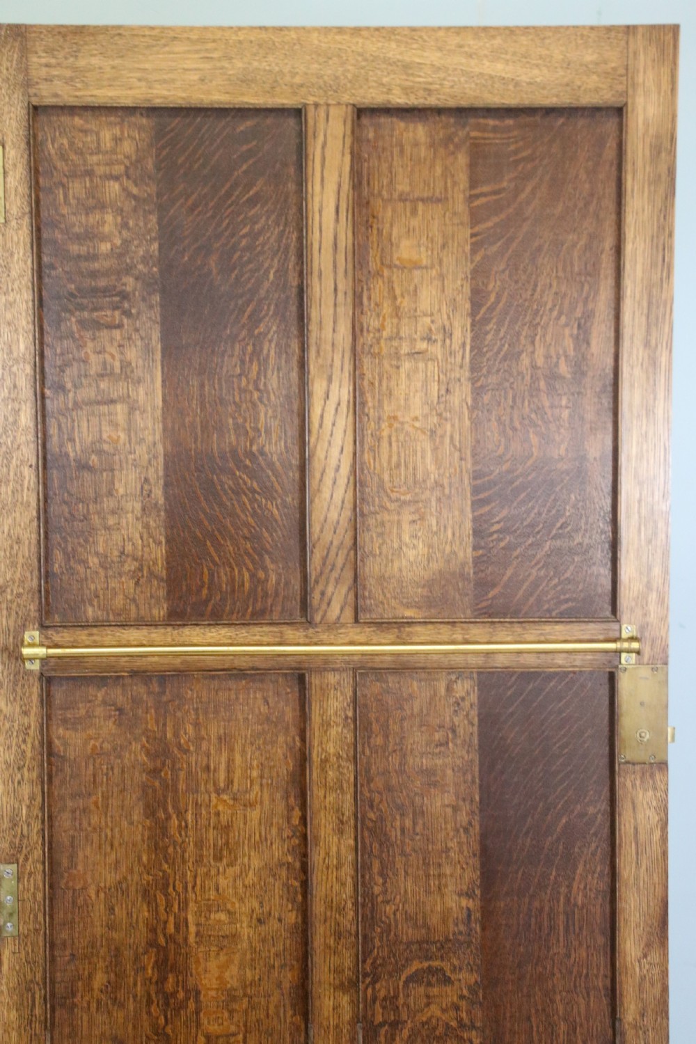 A lovely late 19th or early 20th century oak wardrobe in the ‘campaign’ style. View IX