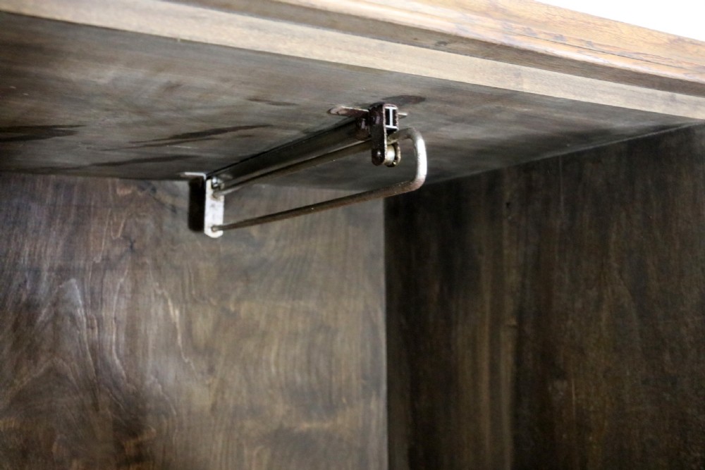 A lovely late 19th or early 20th century oak wardrobe in the ‘campaign’ style. View XVI