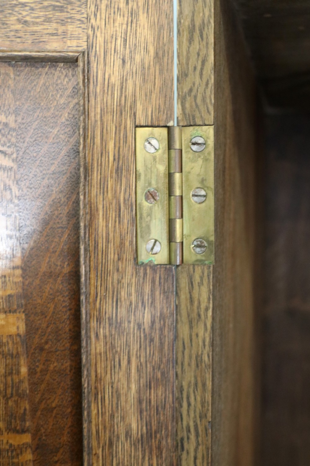 A lovely late 19th or early 20th century oak wardrobe in the ‘campaign’ style. View XVII