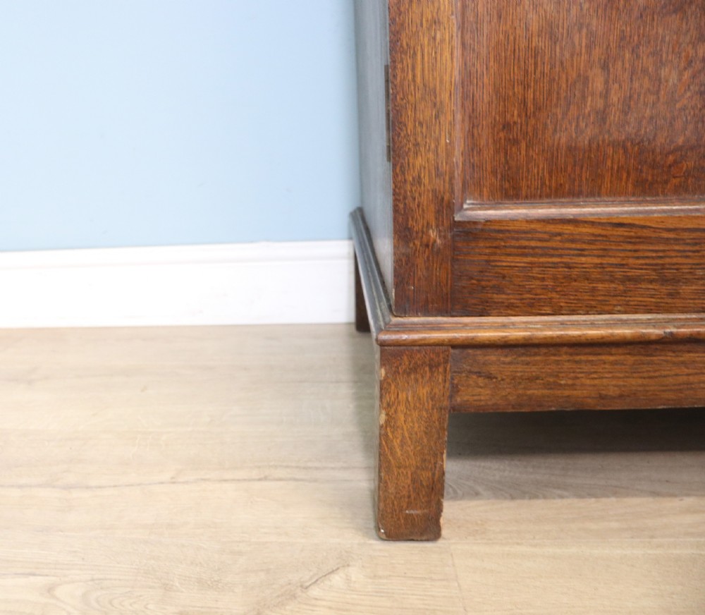 A lovely late 19th or early 20th century oak wardrobe in the ‘campaign’ style. View XXI