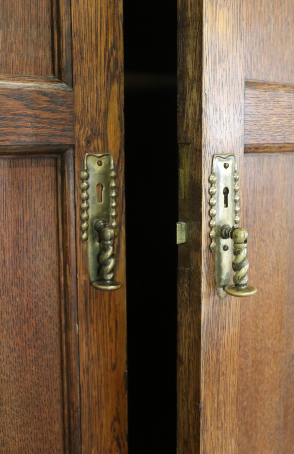 A lovely late 19th or early 20th century oak wardrobe in the ‘campaign’ style. View XXII