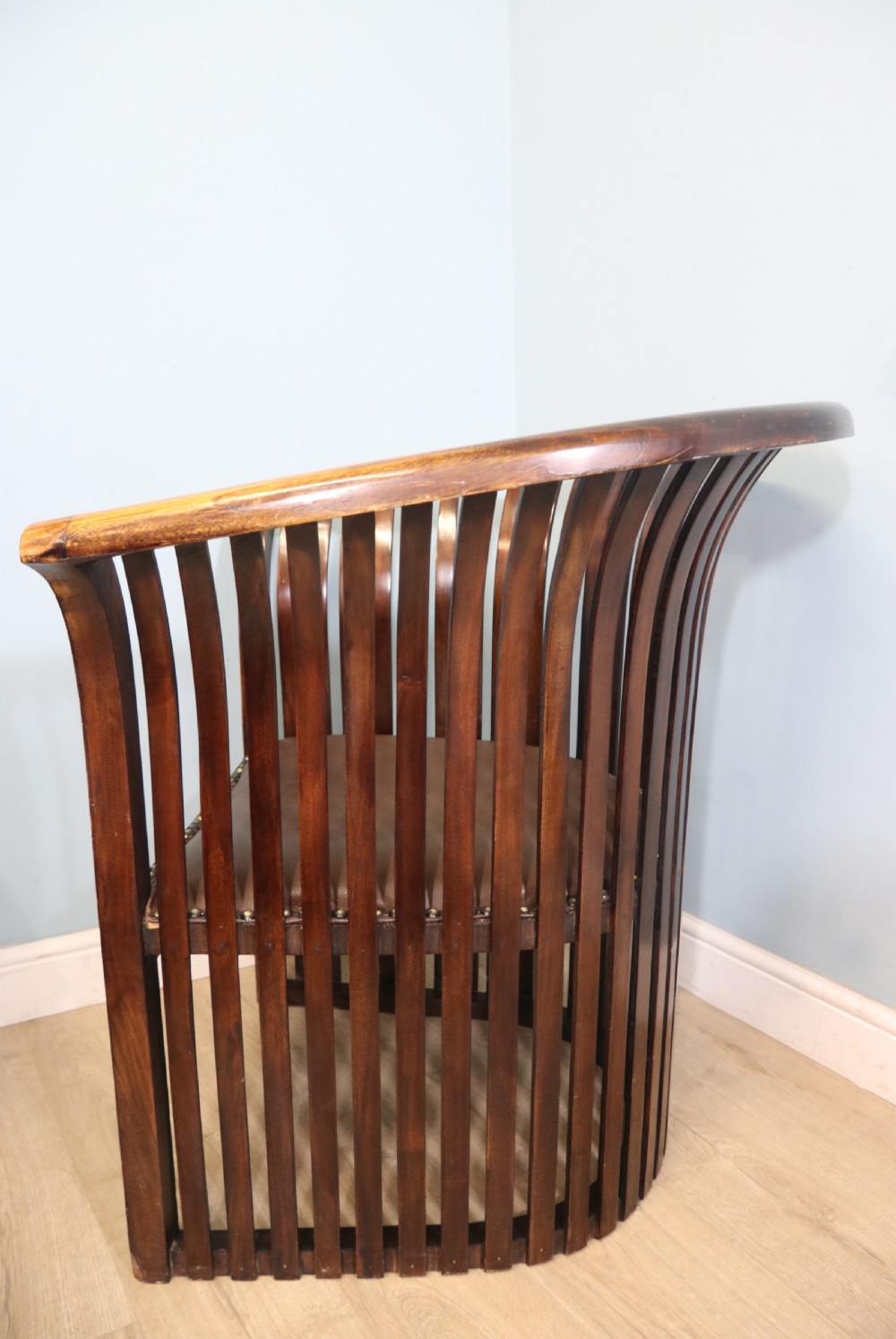 An early 20th century hardwood framed chair with curved back View V