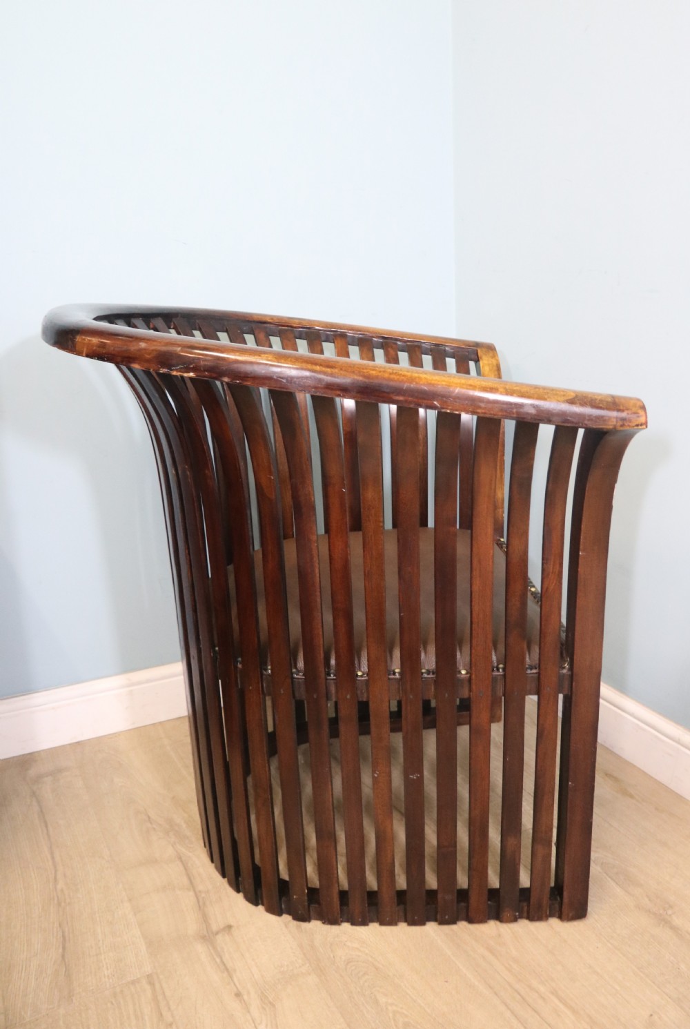 An early 20th century hardwood framed chair with curved back View X