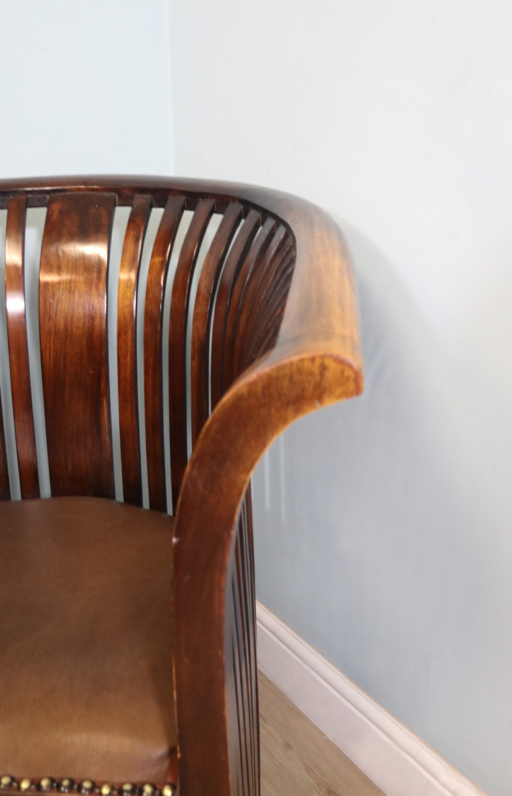 An early 20th century hardwood framed chair with curved back View XVI
