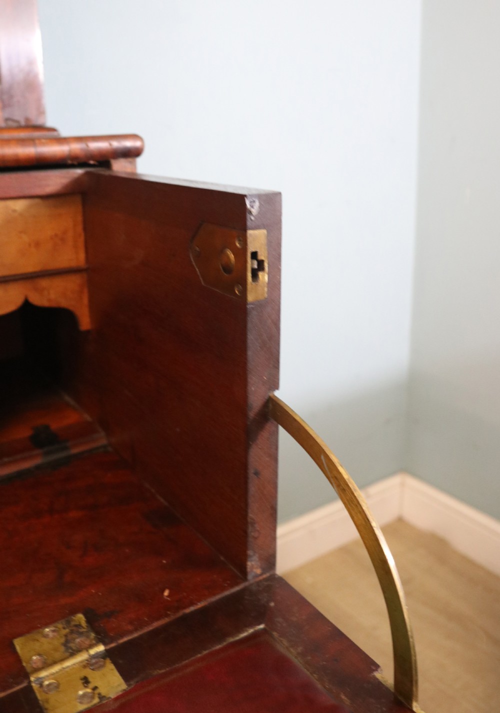 A late Georgian mahogany secretaire bookcase with glazed upper doors featuring Roman numerals, a drop-front fitted writing desk, and two cabinet doors below. View XXVII
