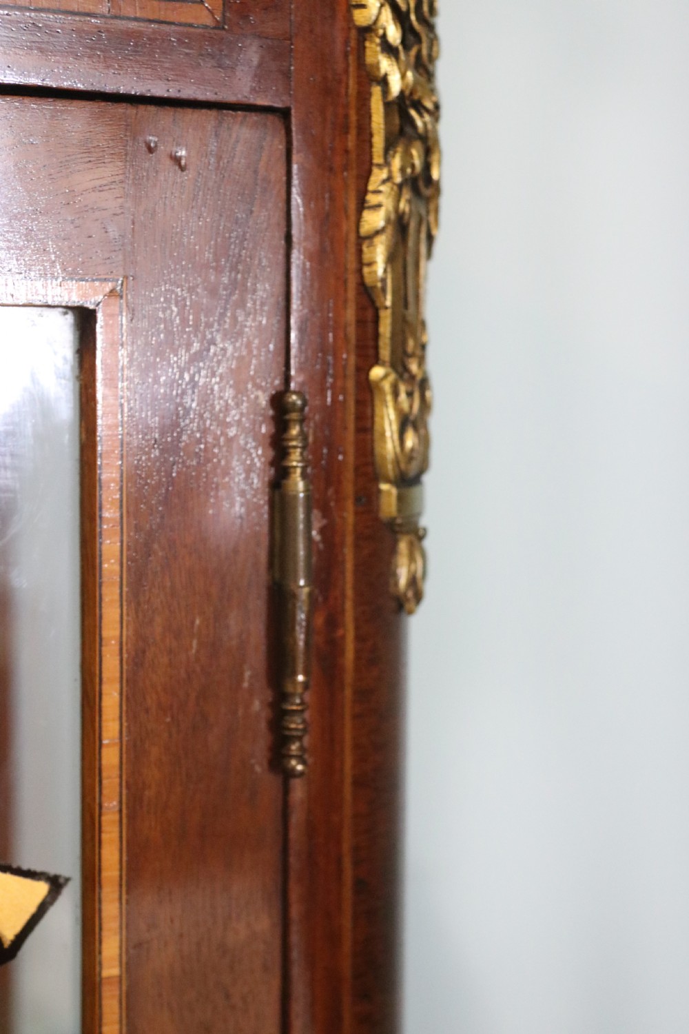 A French mahogany vitrine featuring a marble top, glass display door with gilt perfumery lettering, glass shelves, and brass mounts. View XXIV