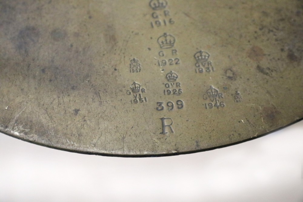 A large hanging brass beam balance scale featuring stamped lettering, suspended chain links, and two circular brass pans. View XXVI